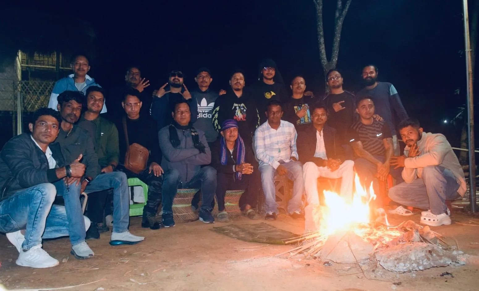 Guests gathered around a bonfire at Mridu