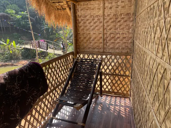 A quiet seat on the bamboo balcony