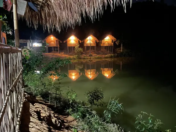 Cottage lights reflected in the pond